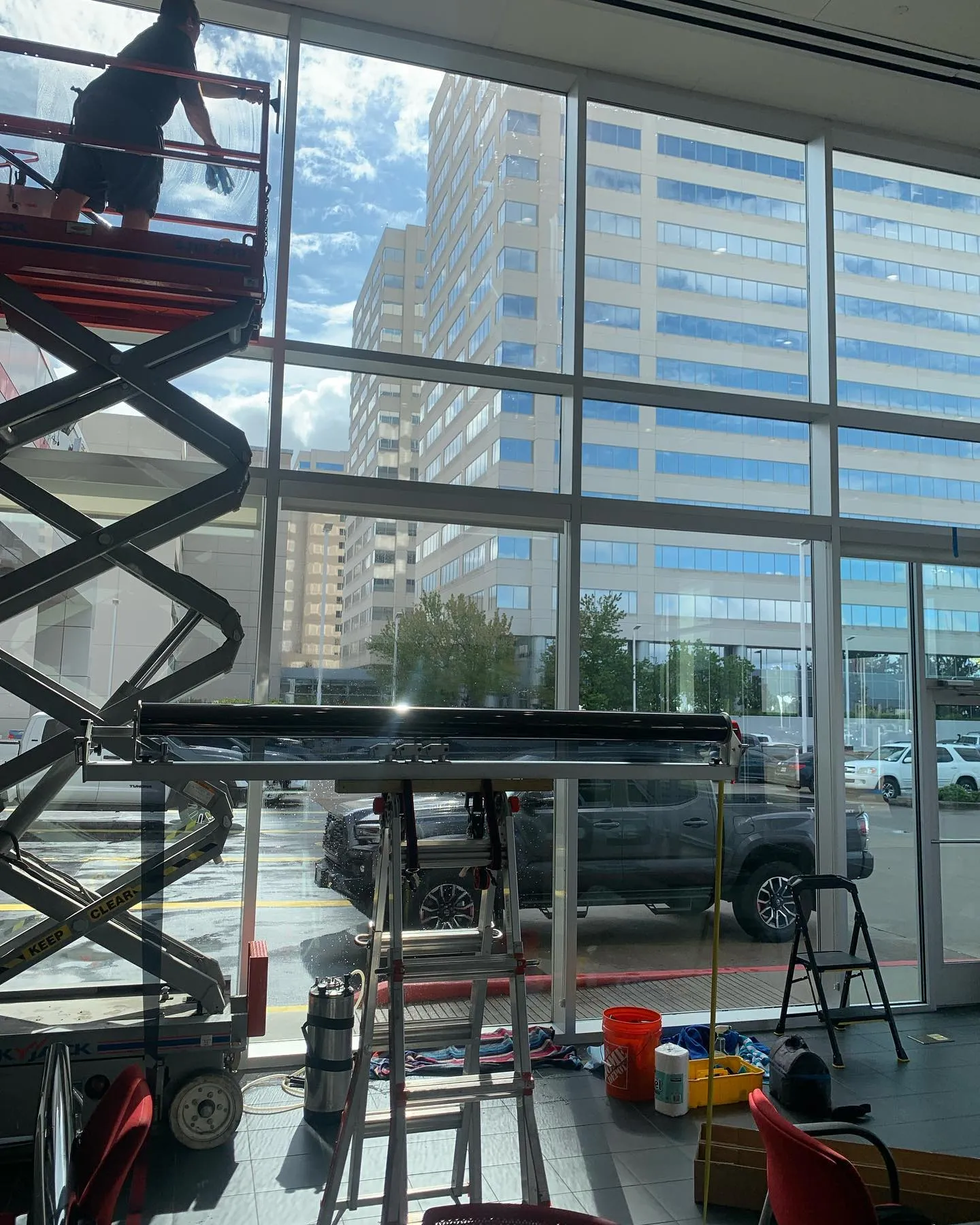 Person window tinting a commercial building